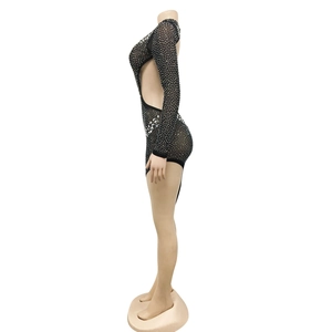 Detail of black mesh mini dress with silver rhinestones and sexy side cut-out design