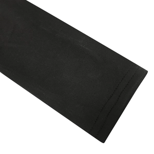 Detail shot of black mesh dress showing high-quality double-stitched sleeve cuffs and seams