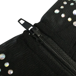 Detail of sheer mesh fabric with colorful rhinestones and a black hidden zipper