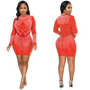 Detail view of red bodycon mesh dress with white rhinestones and geometric patterns