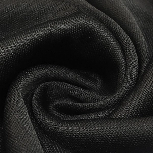 Macro shot showing the texture of breathable black mesh fabric with sparkling rhinestones
