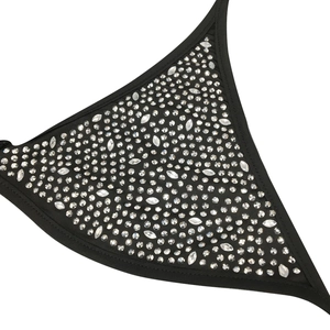 Detailed close-up of sparkling rhinestones and tassels on a black bodycon party dress