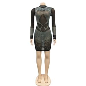 Detail of silver rhinestones and sheer black mesh fabric on a sexy bodycon dress