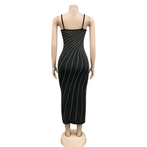 Detailed back view of a black bodycon dress with sparkling rhinestones in wave patterns