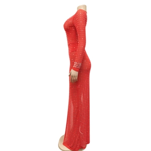 Detail of red mesh bodycon dress with sparkling silver rhinestones and high slit cut