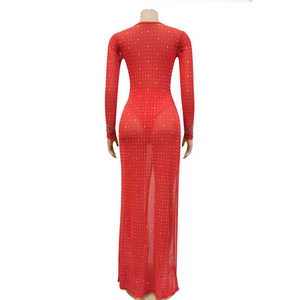 Detail of red mesh bodycon dress featuring shimmering rhinestones and long sleeves