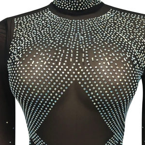 Detail of sheer black mesh top featuring intricate rhinestone necklace pattern