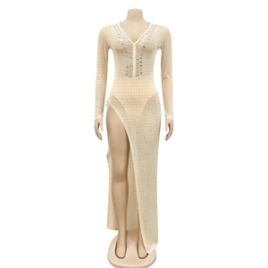 Detail showing the champagne mesh fabric with sparkling rhinestones and a deep V-neckline