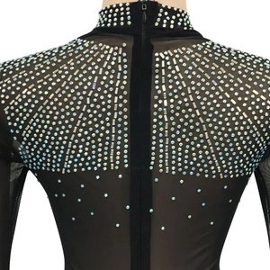 Detail of sheer black mesh dress with silver rhinestones and back zipper closure