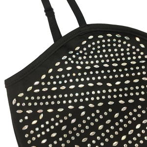 Detail of adjustable black strap and sparkling rhinestone pattern on women's party dress