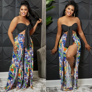 Women's chic two-piece set featuring a black bow tube top and printed high-slit wide-leg pants