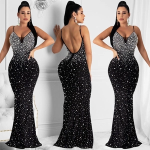 Detail of black rhinestone mermaid evening dress with deep V-neck and open back design