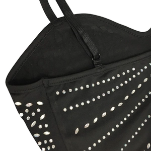 Close-up of black spaghetti strap dress with intricate crystal rhinestones detail