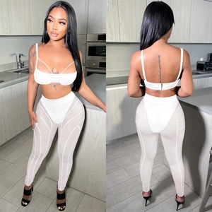 Conjunto sexy blanco de dos piezas para mujer con top corto y pantalón de malla fina
