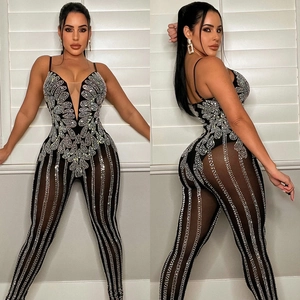 Sexy black mesh jumpsuit with rhinestone floral patterns and sheer vertical stripes