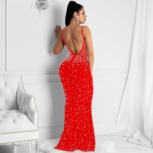 Detail of red backless bodycon maxi dress with shimmering pearls and thin straps