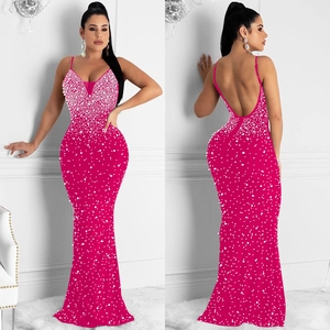 Detailed view of fuchsia mermaid maxi dress with gradient pearl embellishments