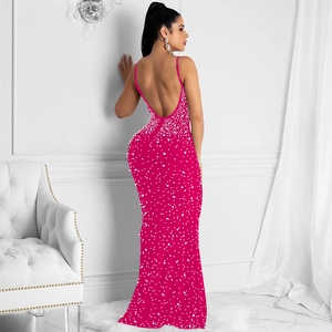 Detailed back view of hot pink rhinestone maxi dress with thin straps and open back