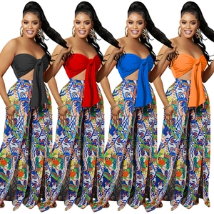 Women's two-piece set featuring a bow tube top and vibrant floral wide-leg pants