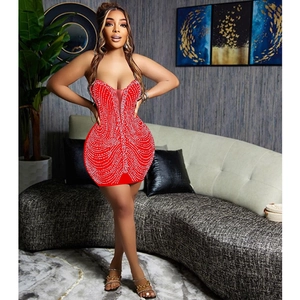 Detailed view of red bodycon mini dress with rhinestones and sexy v-neck cutout design