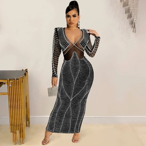 Detailed view of the sheer mesh waist inserts and rhinestones on this black V-neck maxi dress