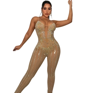 Detail showing the sheer mesh fabric and rhinestone embellishments on a women bodysuit