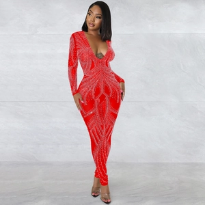 Detail of red mesh jumpsuit with shimmering rhinestones in radial pattern