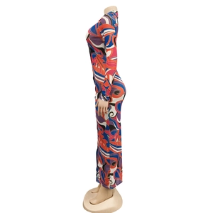 Detail of sheer mesh long sleeve dress with colorful abstract geometric prints