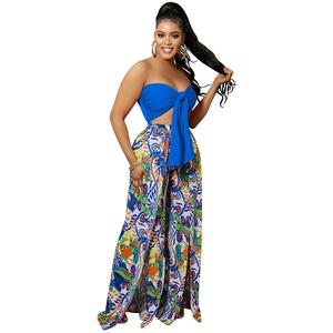 Detail of bohemian floral print tube top with bow and side slit wide leg pants set