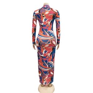 Detail of multi-color abstract print on slim-fit mesh maxi dress with high neck