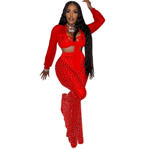 Detail of red mesh top with rhinestones and tie-front design for party outfits