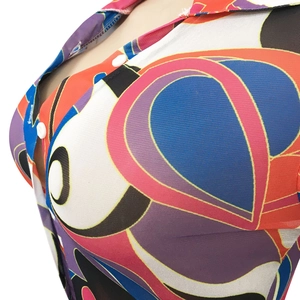 Detail of colorful geometric print sheer mesh dress with white buttons and V-neckline