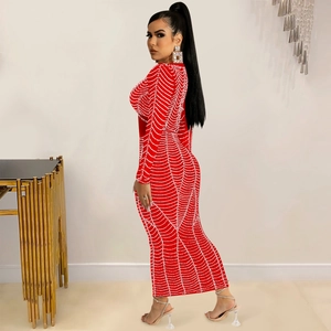 Close-up of elegant red mesh maxi dress with white pearl wave pattern and long sleeves