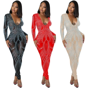 Detail view of sheer mesh jumpsuits with V-neck and sparkling rhinestones in three colors