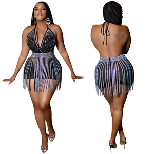 Detailed back view of backless halter top with glittering rhinestone tassel skirt set