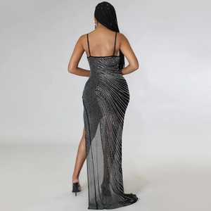 Detail of black rhinestone mesh dress showing sparkling silver crystals and sexy side slit