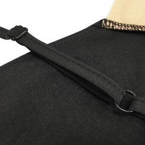 Close-up of adjustable spaghetti straps with metal buckles on black mesh jumpsuit