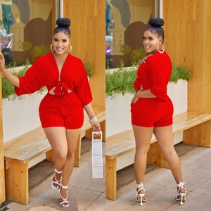Women's red two-piece lounge set with deep V-neck tie-up top and high-waist tight shorts