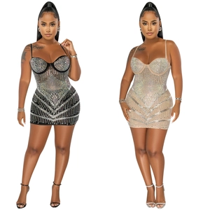 Detail of sexy bodycon mini dress with rhinestones in black and beige colors