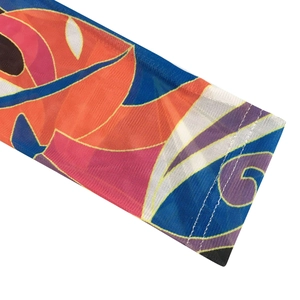Detailed macro view of colorful mesh floral print fabric with high-quality stitching seams