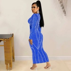 Detailed close-up of the royal blue mesh dress with intricate white spiderweb rhinestone patterns