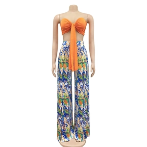Close-up of vibrant bohemian floral print high-waisted wide-leg trousers for women