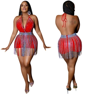 Detail of red rhinestone fringe skirt and halter top for stage party and nightclub
