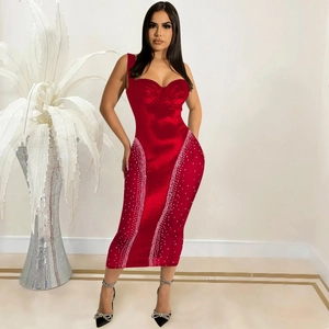 Detailed view of dark red bodycon dress featuring elegant vertical rhinestone accents