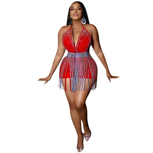 Detail of red rhinestone halter top and fringe skirt set for evening party glam