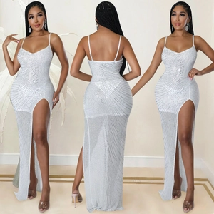Detailed view of white sequined mesh dress with thin straps and a high side slit