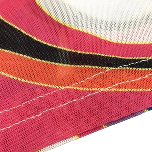 Close-up of colorful mesh fabric featuring wave patterns and neat double-needle stitching