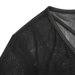 Detail of black sheer mesh top featuring V-neckline with delicate crisscross straps