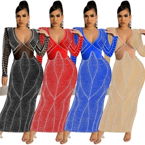 Detail showing sheer mesh panels and sparkling rhinestones on the V-neck evening gown