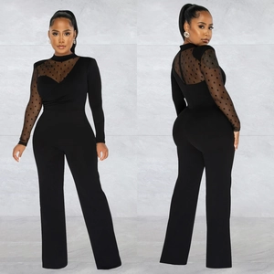 Chic black long sleeve jumpsuit featuring sheer polka dot mesh sleeves and wide leg trousers